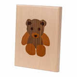 Wood inlay teddy bear design plaque for woodworking projects.