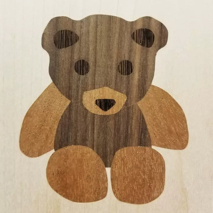 Wood inlay teddy bear design with contrasting light and dark veneers
