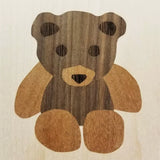 Wood inlay teddy bear design with contrasting light and dark veneers
