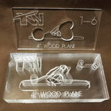 Acrylic 4-inch wood plane jigs for woodworking with engraved design and hand grip cutouts.