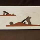 Wood inlay art of two hand planes on light wood background for woodworking decor