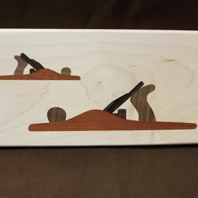 Wood inlay art of two hand planes on light wood background for woodworking decor
