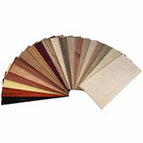 Fan of assorted wood veneer samples for woodworking projects and crafts