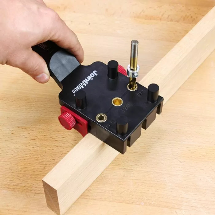 Woodworking dowel jig tool aligning drill bit on wooden board for precision joinery
