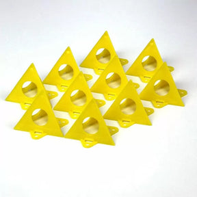 Set of yellow plastic triangular painter's pyramids for woodworking, arranged on white background