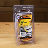 Zero clearance tape package for woodworking on wooden workbench, includes five strips.