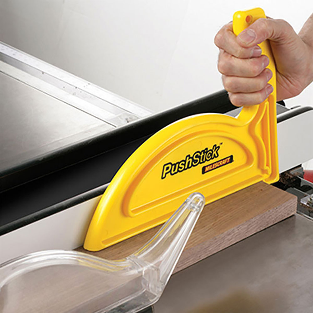 milescraft push stick being used on a table saw