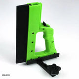 Green woodworking push block with handle and adjustable black guide for table saw safety