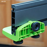 Router table fence attachment with green plastic knob and aluminum track, woodworking tool