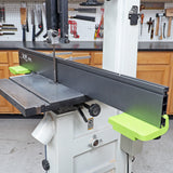 Band saw machine with adjustable fence and workbench in a woodworking shop
