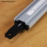 Aluminum fence with 3-position clamping lever and measurement scale on a wood surface