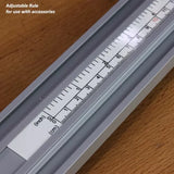 Adjustable woodworking rule with inch and centimeter markings on wood surface
