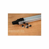 Aluminum fence accessory with mounting knobs for woodworking, displayed on a wooden surface.
