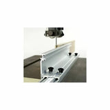 Aluminum bandsaw fence guide with adjustment knobs on a woodworking table saw