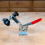 Front view of the Infinity Tools medium toggle clamp, open, mounted on a workbench