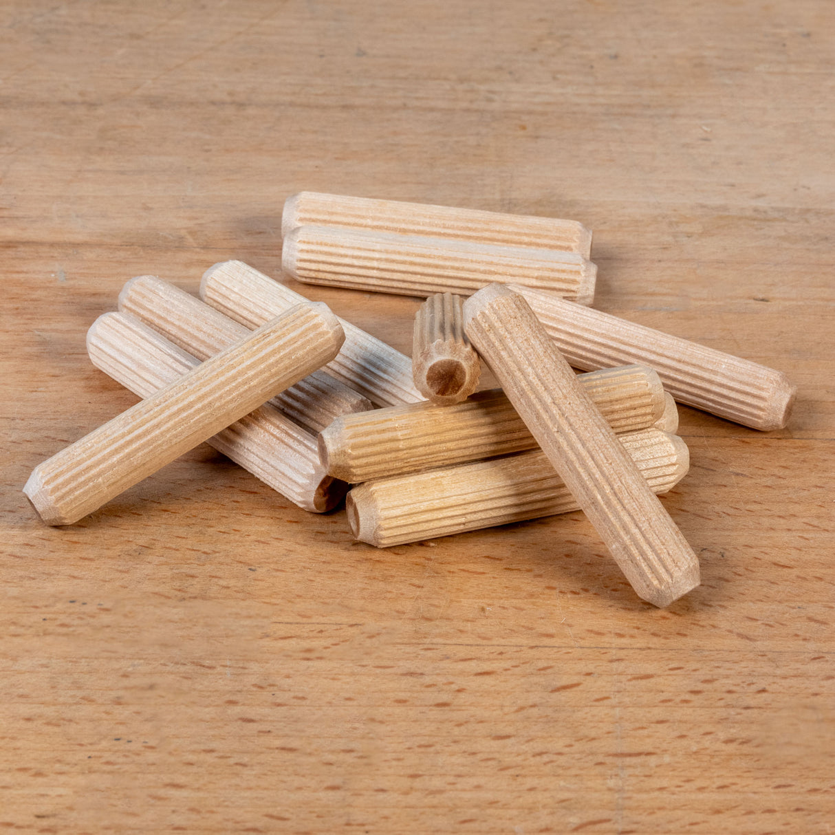 Wooden dowels on a wooden surface