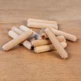 Wooden dowels on a wooden surface