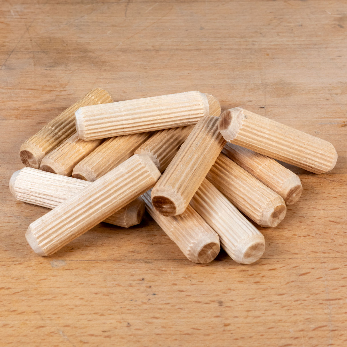 Wooden dowels on a wooden surface