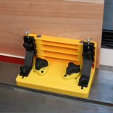 Magnetic featherboard woodworking jig securing wood on table saw