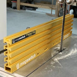 Yellow woodworking table saw fence with magswitch for precision wood cutting