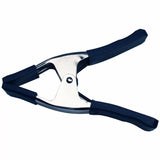 Metal spring clamp with blue rubber grips for woodworking and clamping projects