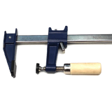 Bar clamp with blue metal body and wood handle for woodworking projects