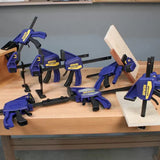 Set of Irwin clamps on a wooden workbench