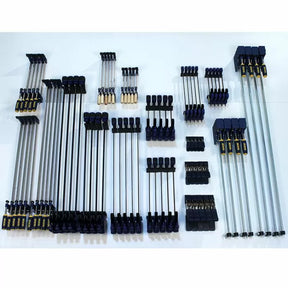 Assorted woodworking bar clamps and pipe clamps organized on a white surface