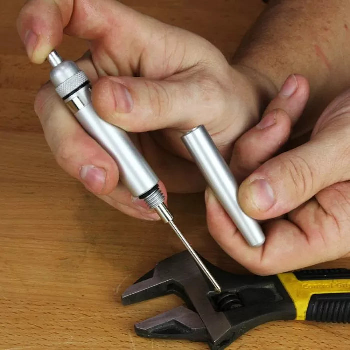 Precision woodworking scribe tool with metal handle shown on a wooden workbench