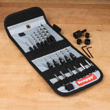 Woodworking drill and driver bit set in a foldable case on a workbench