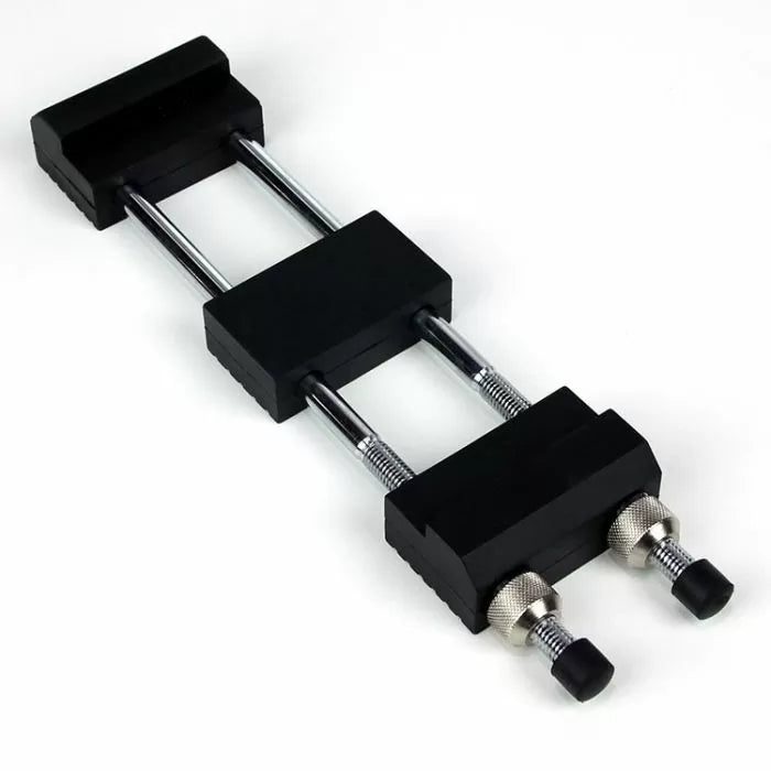 Adjustable honing guide with dual rods and knurled knobs for sharpening woodworking tools