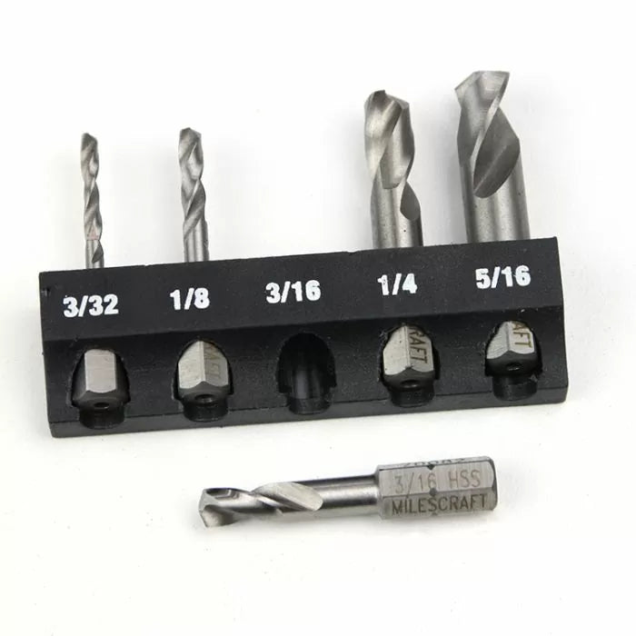Set of hex shank drill bits with size markings for woodworking, displayed in a holder.