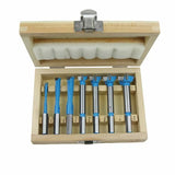 Woodworking router bit set with blue-tipped bits in a wooden storage case