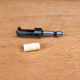Drill bit and dowel center pin on wood surface, woodworking tool accessory