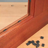 Wooden frame with black rubber panel spacers for woodworking on a workbench