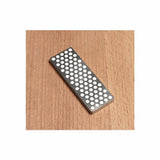 Diamond sharpening stone for woodworking tools on wooden surface