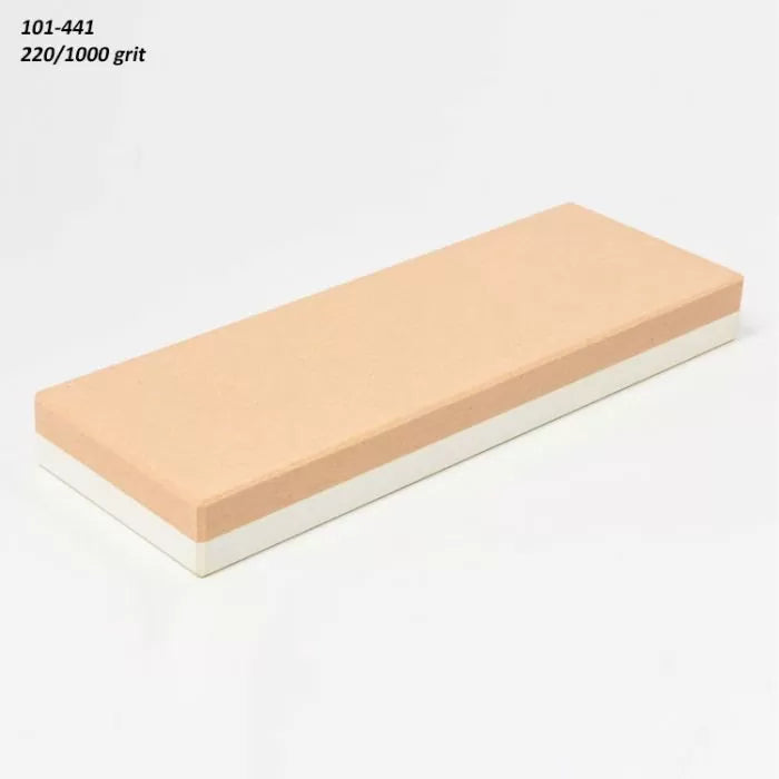 Dual grit 220/1000 sharpening stone for woodworking tools on white background.