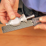 Carbide router bit being sharpened with diamond sharpening stone for woodworking tools