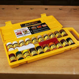SoftWax wood repair kit with colored wax sticks and applicators in a yellow case on a workbench