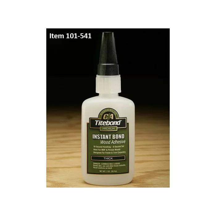 Titebond Instant Bond wood adhesive bottle for woodworking on a wooden surface