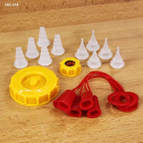 Glue bottle cap kit with yellow twist lids, red tip covers, and white glue nozzles on wood surface