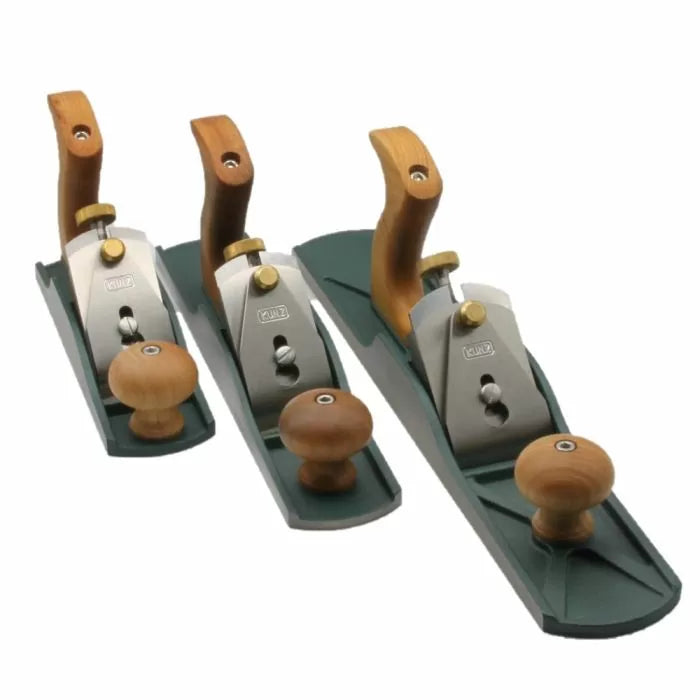 Set of three woodworking hand planes with wooden handles and metal bodies on white background