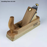 Wood smoothing plane hand tool with wooden handle and metal blade for woodworking projects