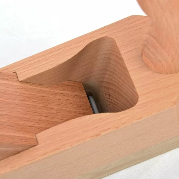 Close-up of a wooden hand plane woodworking tool with exposed blade detail