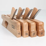 Set of four wooden woodworking planes with steel blades, numbered 18, 24, 27, and 30