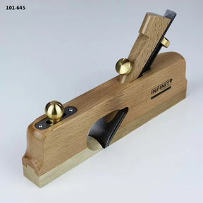 Wooden hand plane with brass knobs and exposed blade for woodworking precision