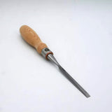 Woodworking chisel with a wooden handle and sharp steel blade on white background