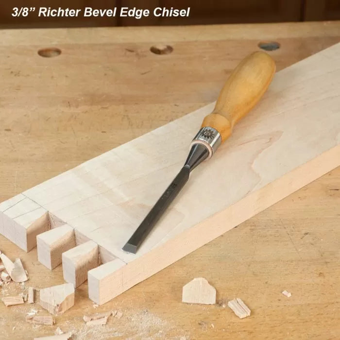 3/8 inch bevel edge chisel on workbench with dovetail wood joints and wood shavings