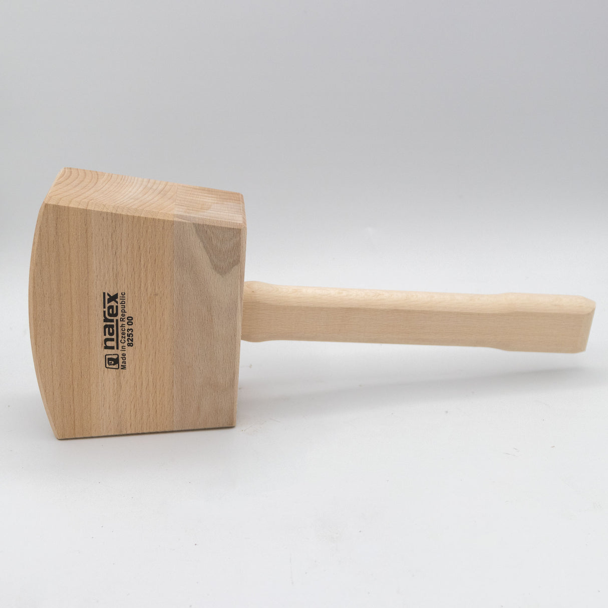 Wooden bench mallet with rectangular head and handle on white background, ideal for woodworking