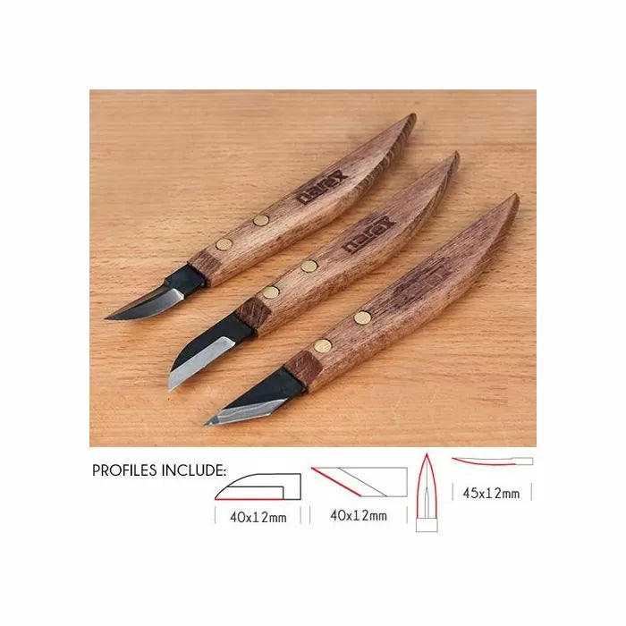 Set of three wood carving knives with ergonomic wooden handles and various blade profiles on a wooden surface